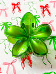 Green poinsettia hair clip